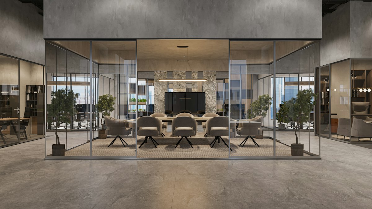 Glass-walled office meeting room with table and chairs